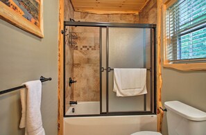 A bathroom with a glass-enclosed shower, a bathtub, and a toilet. - Timber Home: Walk to Slopes & N Conway Shops! (North Conway)