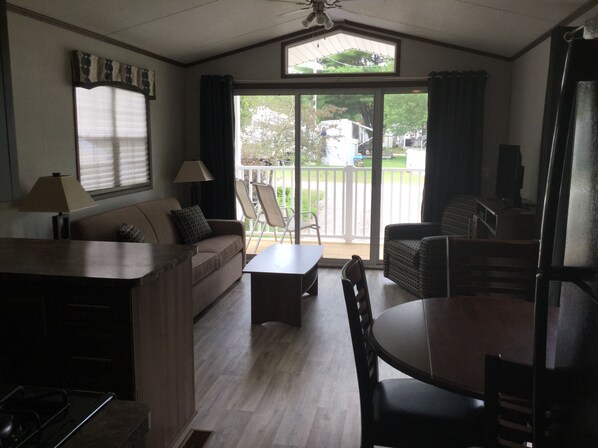 Two Bedroom Cottage (No Linens) | Living area | Fireplace - Hidden Valley RV Resort (Norfolk County)