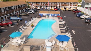 Seasonal outdoor pool, open 9 AM to 9:30 PM, pool umbrellas