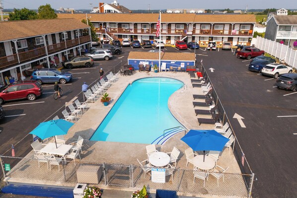 Seasonal outdoor pool, open 9 AM to 9:30 PM, pool umbrellas