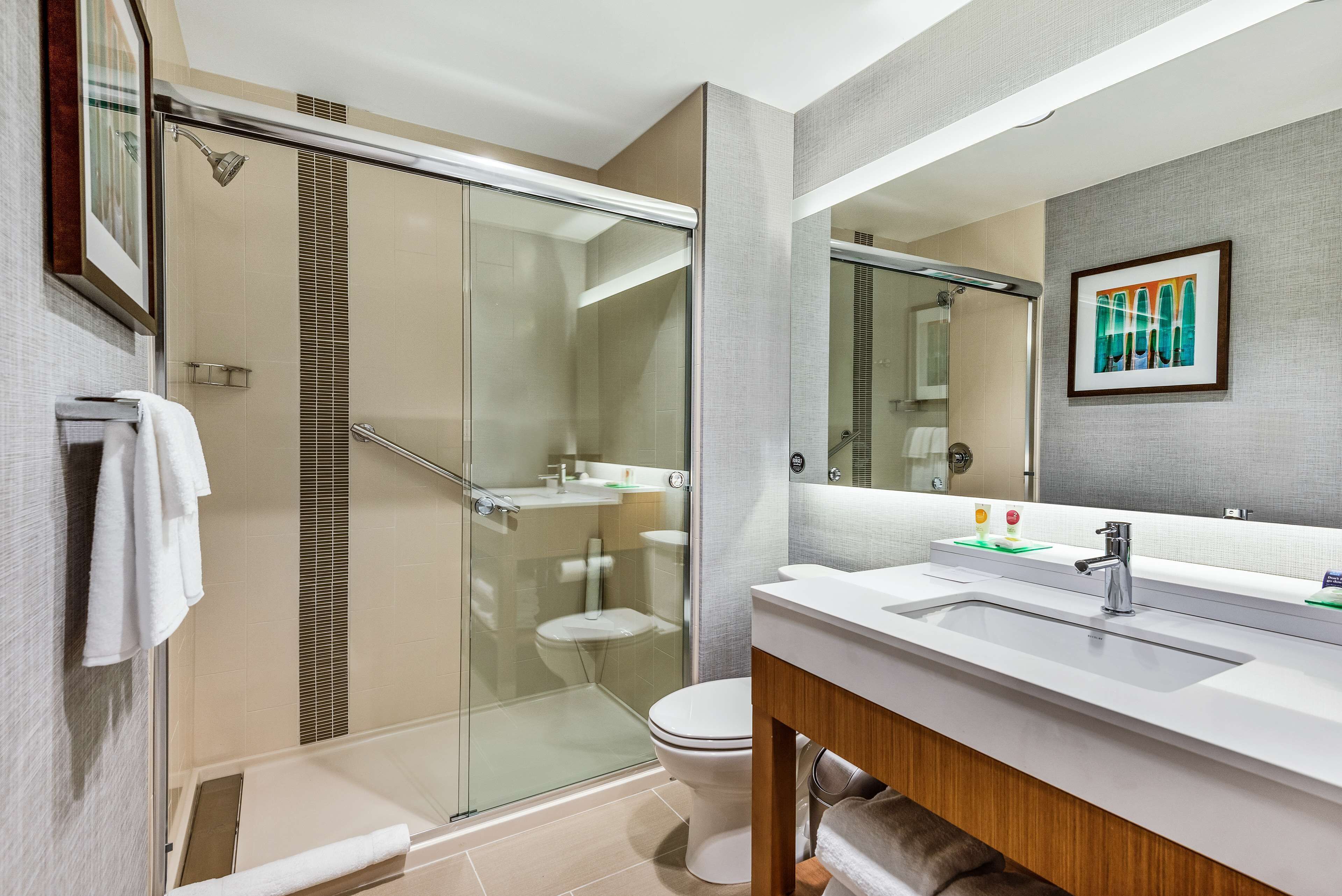 designer toiletries, hair dryer, towels, soap