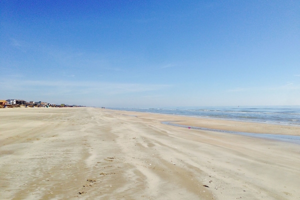 On the beach, sun loungers, beach towels