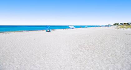 Waterfront condo with pool and easy access to sugar sand beach