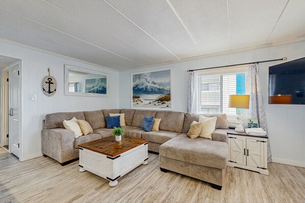 Una televisión, un reproductor de DVD, libros