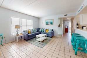 TV, DVD player - Modern dog-friendly condo with a shared pool - moments from the beach (South Padre Island)