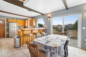 Enjoy meals in the kitchen with a dining area nearby, offering a view of the surrounding neighborhood.