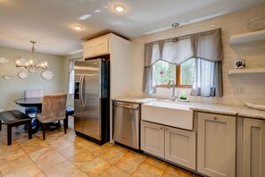 Fridge, microwave, oven, stovetop - Lakefront Home with Porch, Patio and Fenced Yard - Short Drive to Beach (Forestdale)