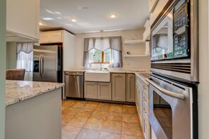 Fridge, microwave, oven, stovetop - Lakefront Home with Porch, Patio and Fenced Yard - Short Drive to Beach (Forestdale)