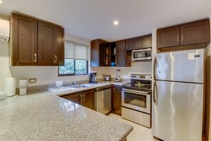 Fridge, oven, stovetop, dishwasher - Four condos together with pool access - near town (Playa Ocotal)