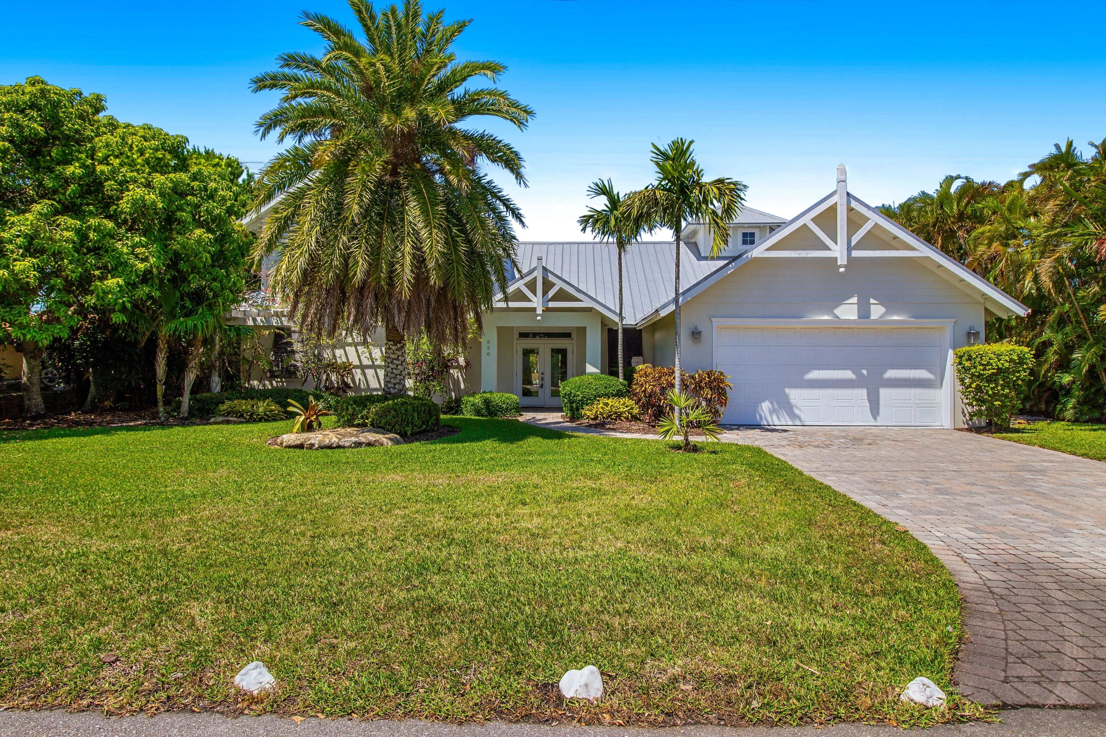 Waterfront home with heated pool + spa, patio, grill, & free WiFi - dog-friendly