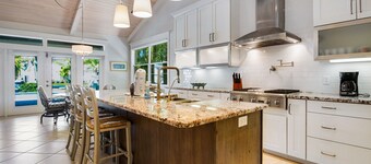 Waterfront home with heated pool + spa, patio, grill, & free WiFi - dog-friendly