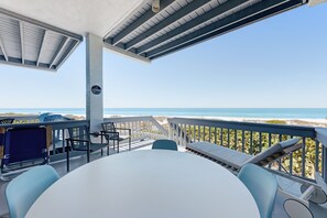 Outdoor dining - Beachfront condo with WiFi, two decks, Gulf views & pool - walk to the trolley (Holmes Beach)
