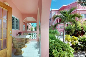 Outdoor dining - Oceanfront condo w/ shared pool, sea view, WiFi & partial AC - steps to beach (San Pedro)