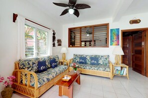 TV - Oceanfront condo w/ shared pool, sea view, WiFi & partial AC - steps to beach (San Pedro)