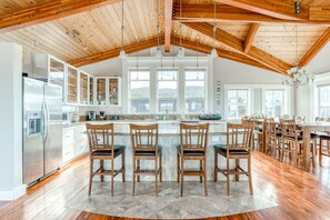 Enjoy cooking in this kitchen with a large island, stainless steel appliances, and ample natural light.