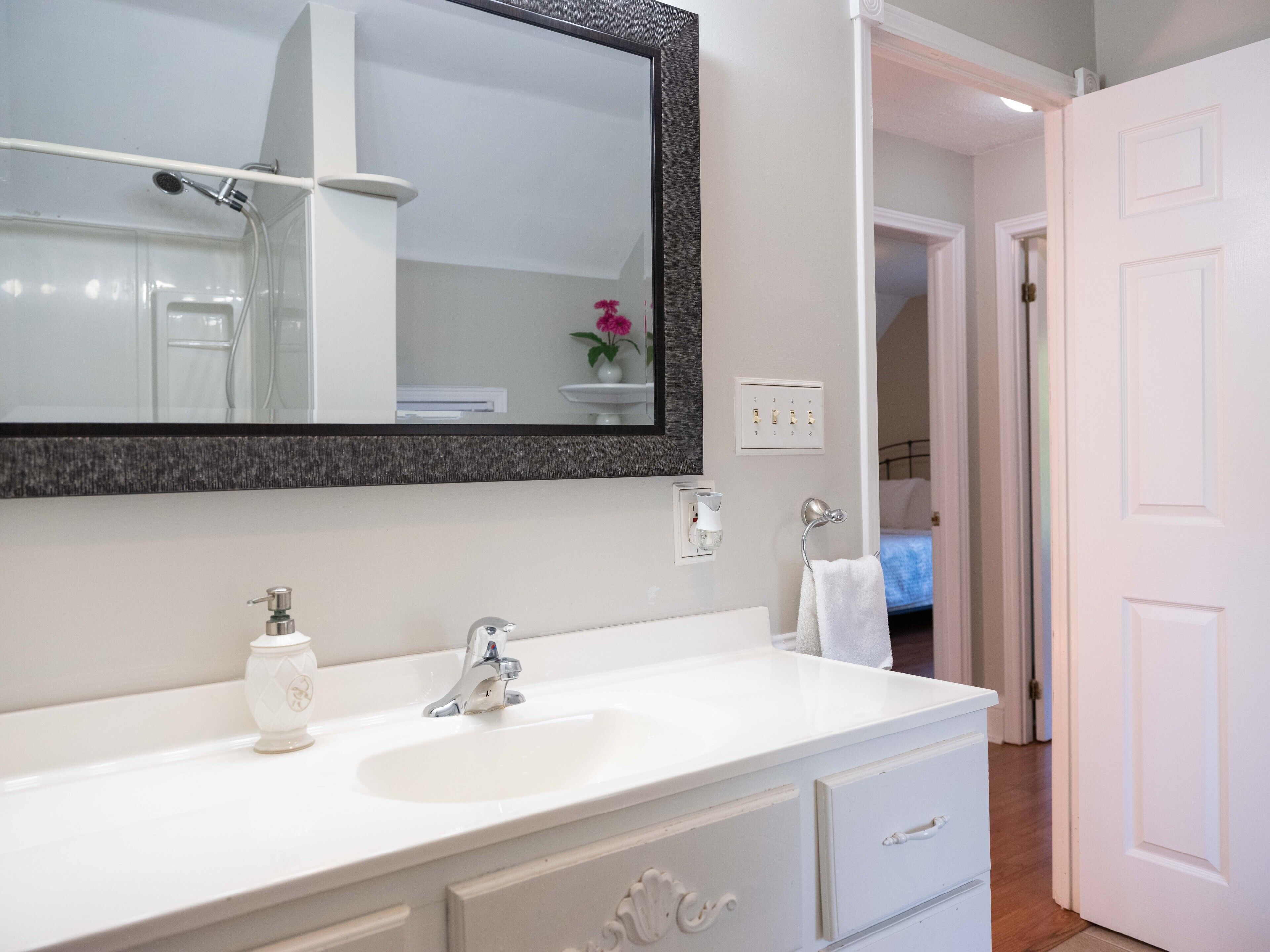 Combined shower/tub, hair dryer, towels, soap