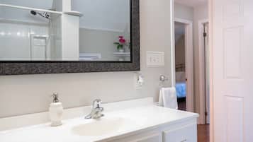 Combined shower/tub, hair dryer, towels, soap