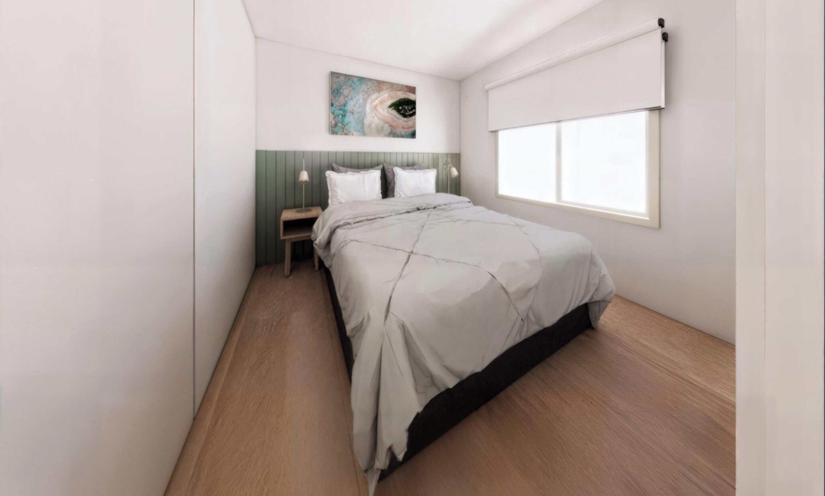 A bedroom with a bed, a nightstand, a lamp, a painting on the wall, and a window.