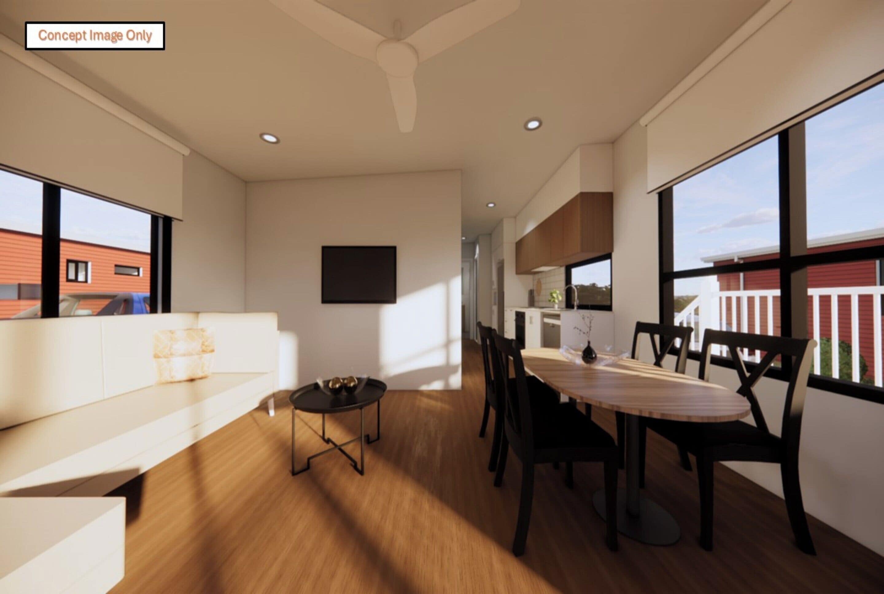 A modern interior with a dining area, a sofa, and large windows.