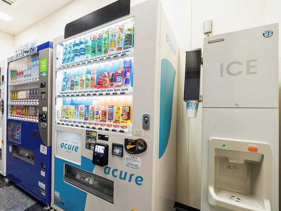 A vending machine with various drinks and a water dispenser.