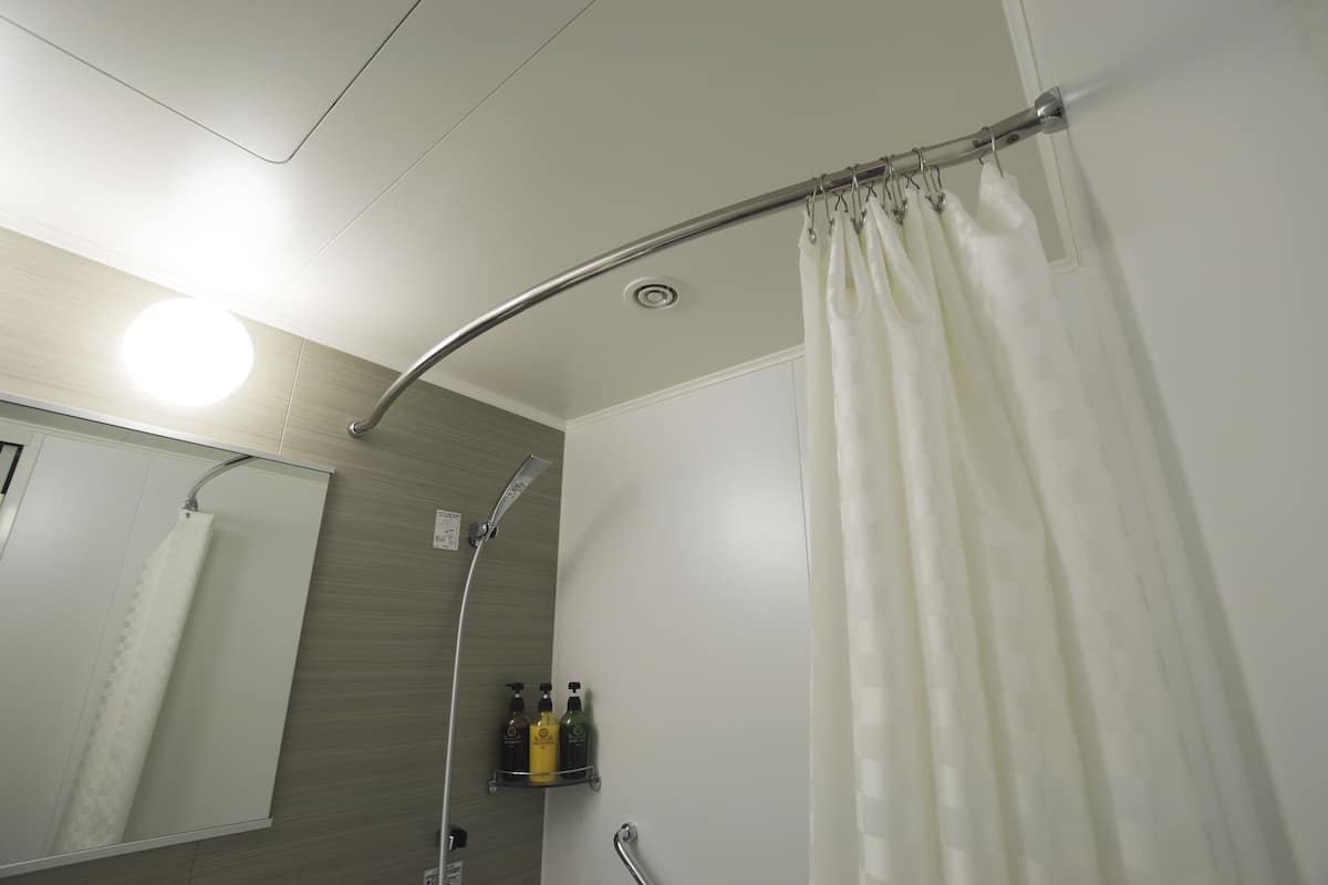 hair dryer, slippers, electronic bidet, towels