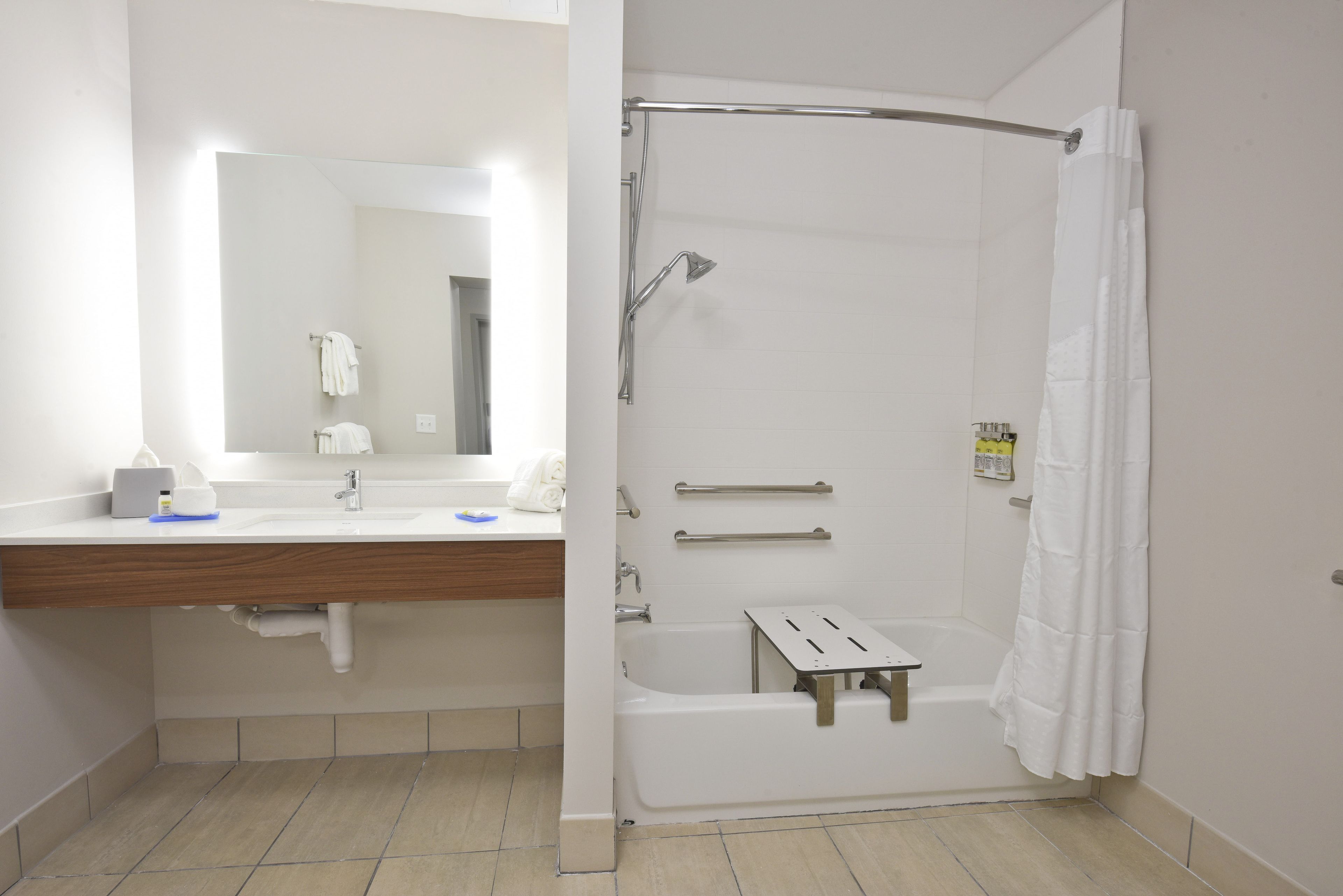 designer toiletries, hair dryer, towels, soap