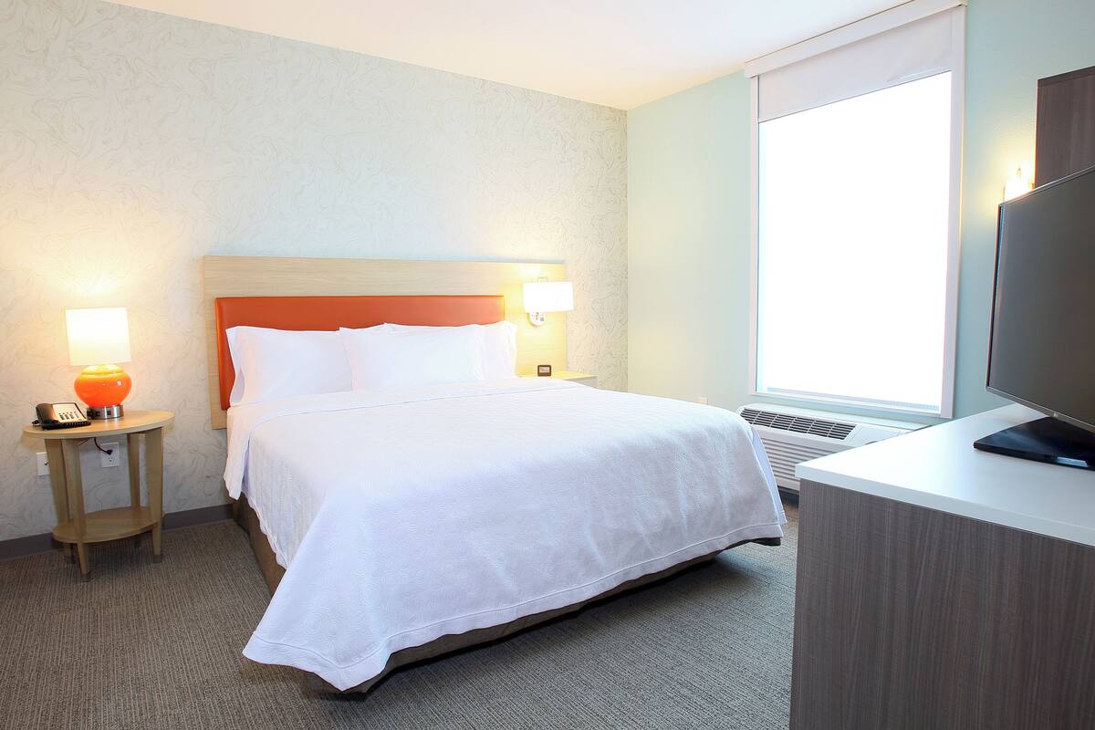 Suite, 1 King Bed, Accessible (Roll-In Shower, Mobility & Hearing) | In-room safe, desk, laptop workspace, iron/ironing board