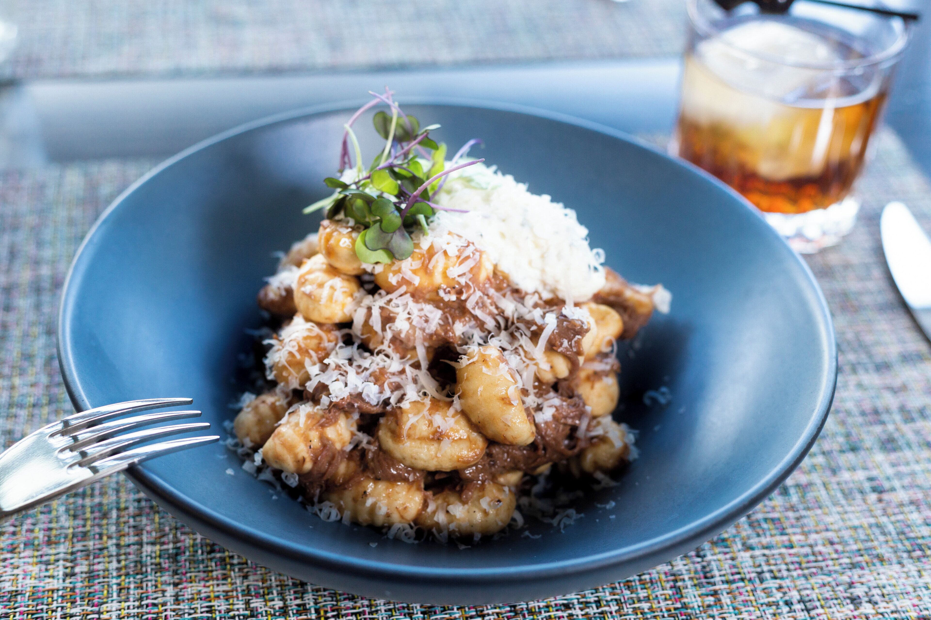 A plate of food with a fork on the side.
