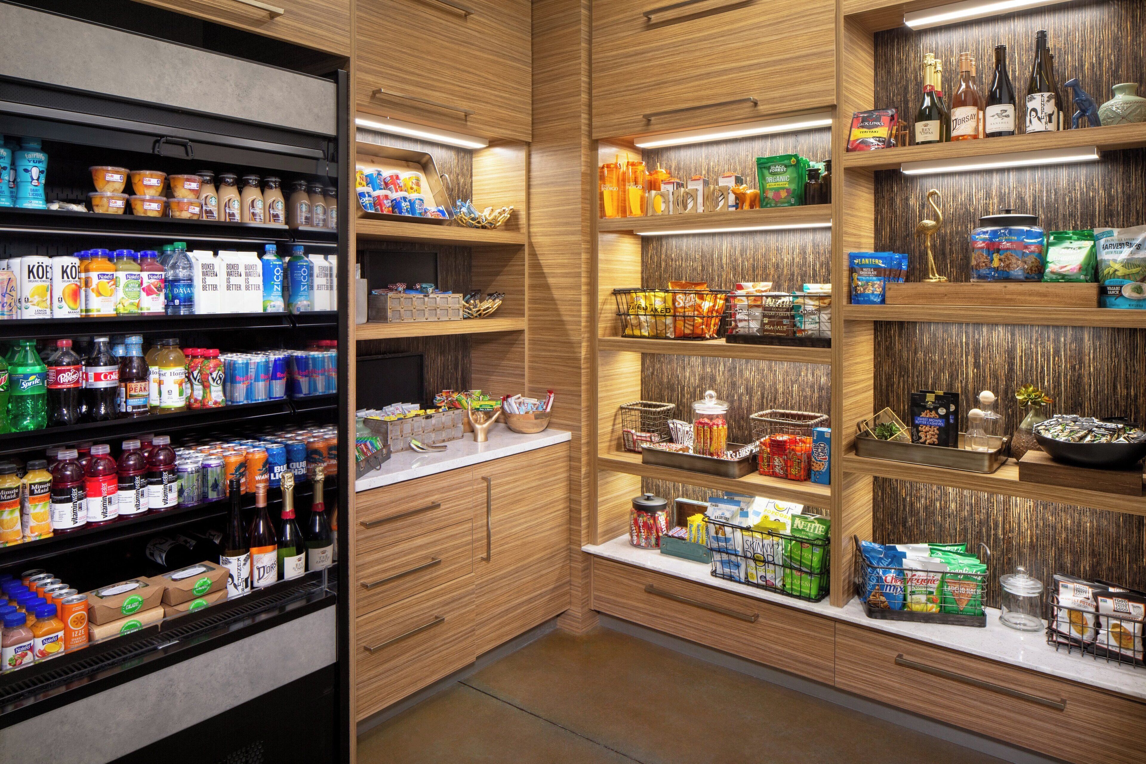 A well-organized pantry with various food items and beverages.