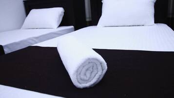 Deluxe Quadruple Room | Egyptian cotton sheets, premium bedding, desk, laptop workspace