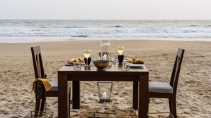 A table set on a beach with a view of the ocean. - The Last House (Morakatiyara)