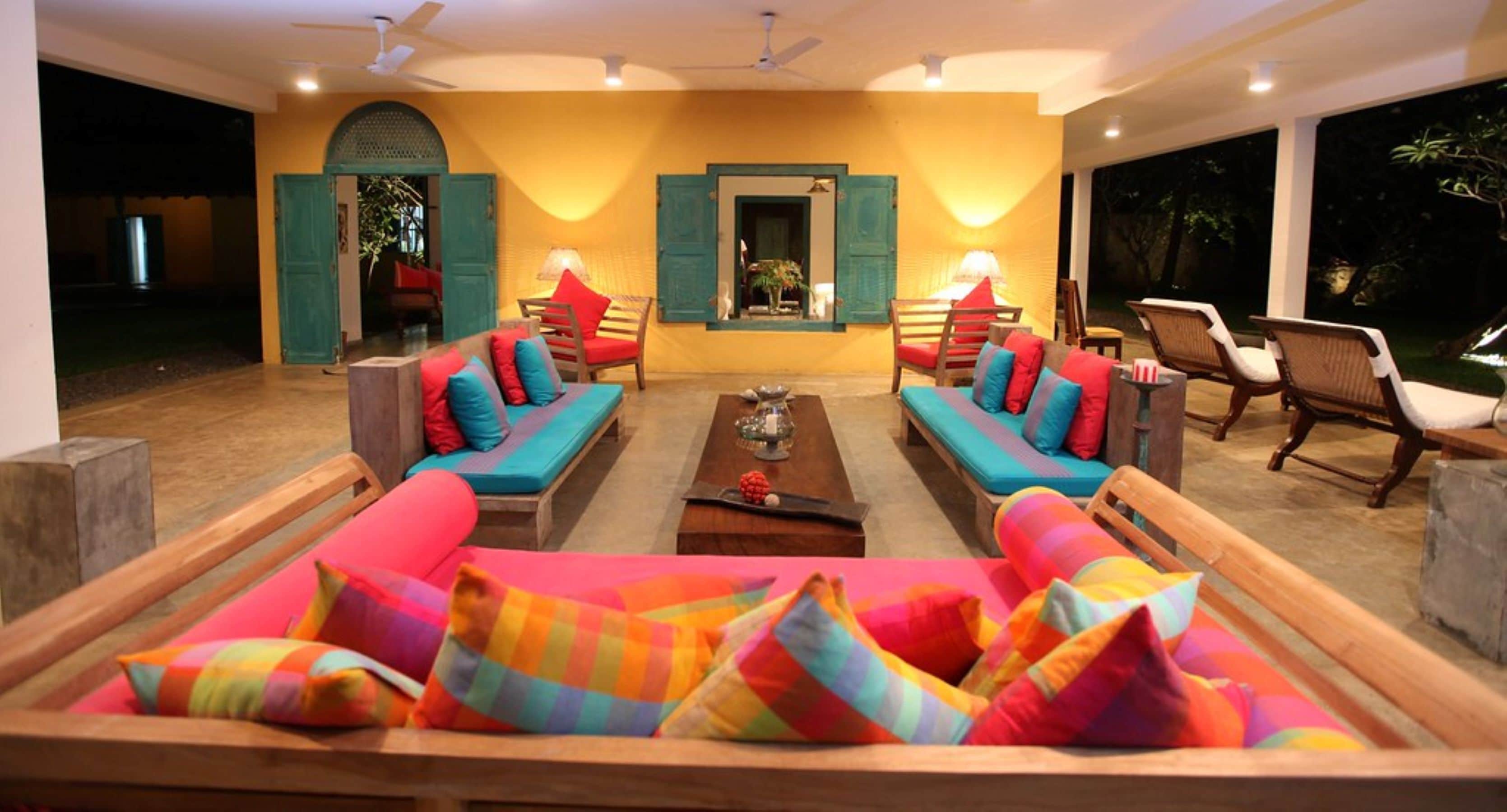 A spacious living area with two sofas, a coffee table, and a view of the outdoors.