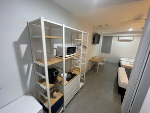 Family Room, Multiple Beds, Non Smoking | Individually furnished, desk, laptop workspace, blackout drapes - Winnellie Hotel Motel (Winnellie)