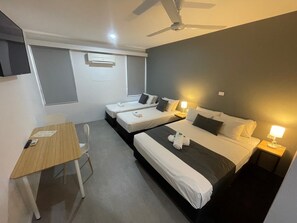 Family Room, Multiple Beds, Non Smoking | Individually furnished, desk, laptop workspace, blackout drapes - Winnellie Hotel Motel (Winnellie)