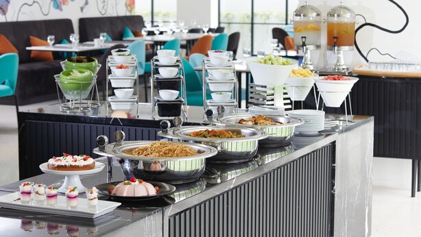 A buffet with various dishes and beverages. - de Braga, ARTOTEL Curated (Bandung)