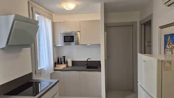 Apartment, 2 Bedrooms | Private kitchen | Fridge, microwave, stovetop, coffee/tea maker