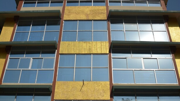 A multi-story hotel building with a sign reading "Hotel Siddharth Palace." - Hotel Siddarth Palace (Mangaldai)
