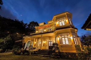 A two-story building with a sign reading "Dragon Dalat." - Dragon Dalat Villa (Da Lat)