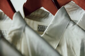 A close-up of a white shirt with a visible label reading "ORBS" and "AUTHENTIC DRY." - Orrs (Chatan)