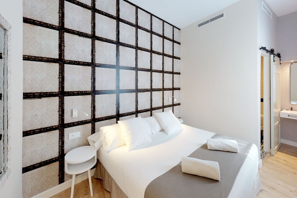 superior double room | living area | flat-screen tv