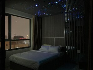 The Gold View Luxury Apartment | Living room | 55-inch flat-screen TV with cable channels, TV, DVD player - The GoldView Luxury Apartment (Ho Chi Minh City)