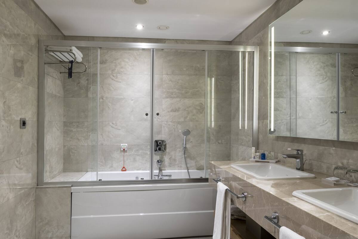 hair dryer, bathrobes, slippers, towels