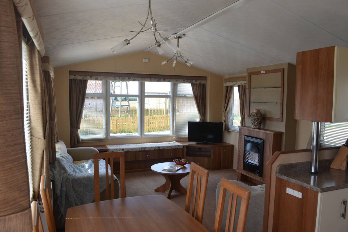 Deluxe Mobile Home, 3 Bedrooms (The Salisbury Select) | Living room | Flat-screen TV