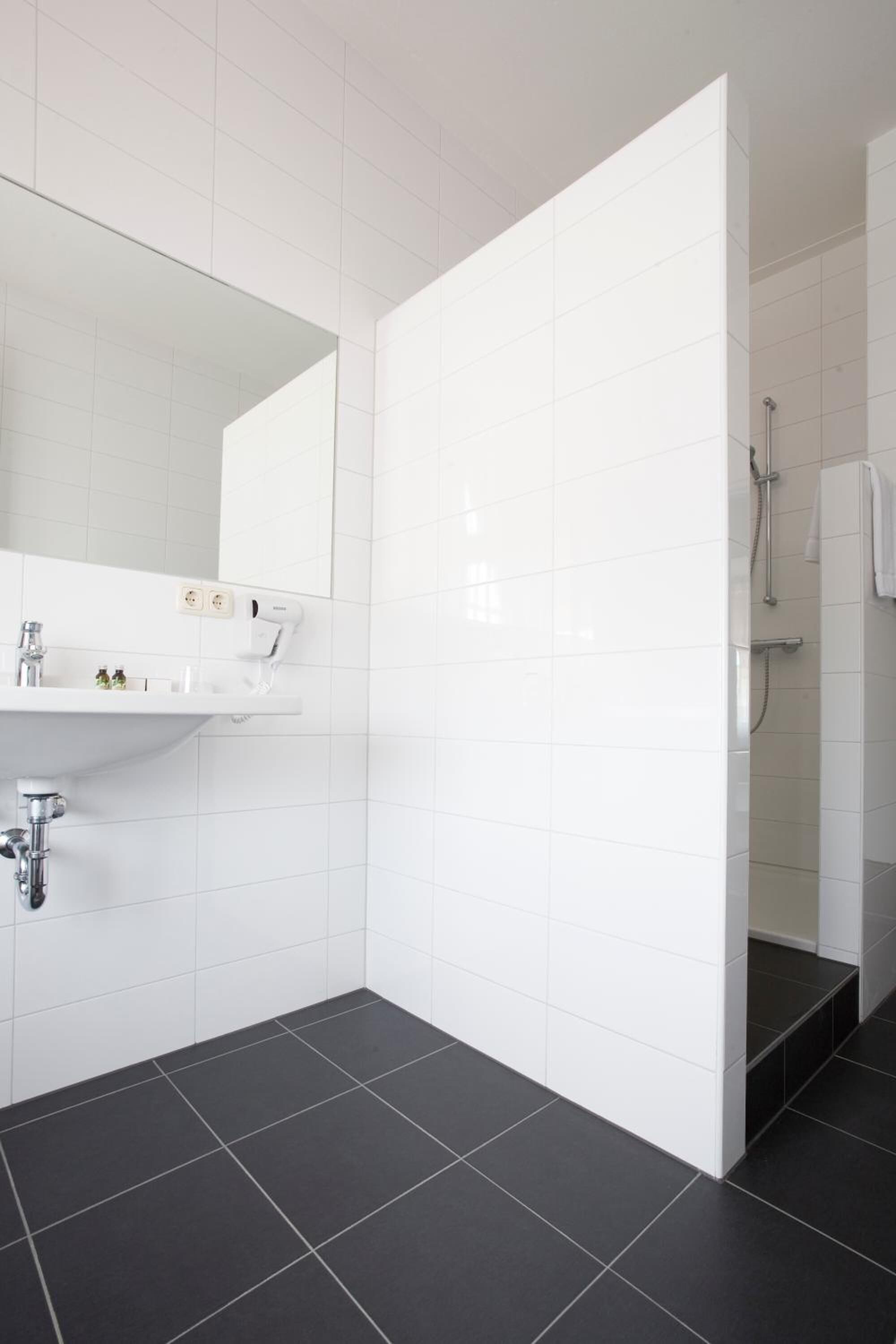 family room | bathroom | shower, free toiletries, hair dryer, towels
