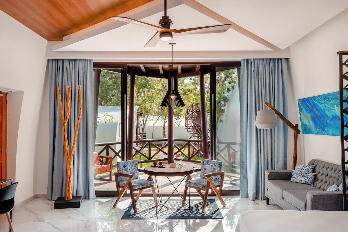 deluxe room | living area | 55-inch flat-screen tv with cable channels, tv, streaming services