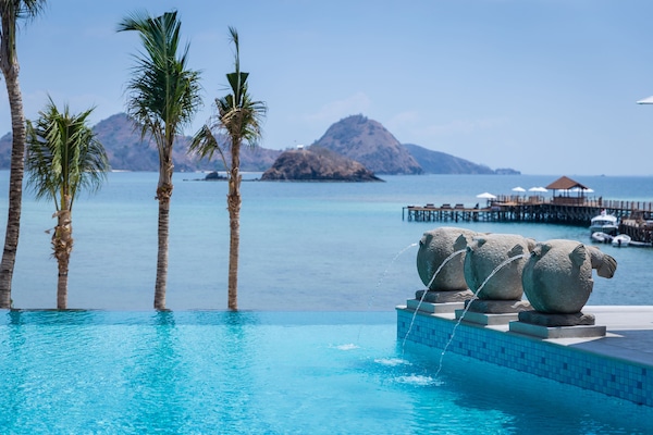 2 outdoor pools, open 8:00 AM to 8:00 PM, pool umbrellas, pool loungers