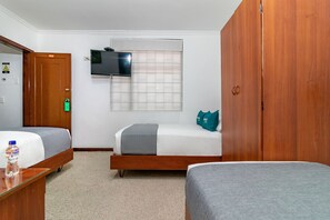 Habitación cuádruple estándar | Ropa de cama de alta calidad, minibar, wifi gratis y ropa de cama