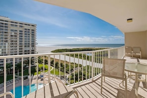 Outdoor dining - Beachfront 2BR/2BA condo with pool, WiFi, and heated pool access. (Marco Island)