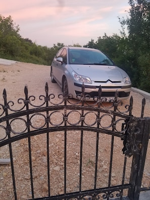 Park your car behind the ornate iron gate and enjoy the serene surroundings.