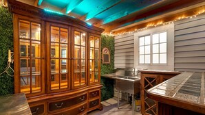 A kitchen with a wooden cabinet, a sink, and a window. - Cozy 10 guest, 4 Bedroom, 2 Bath, Pet Friendly, 2-minute walk to downtown Julian (Julian)